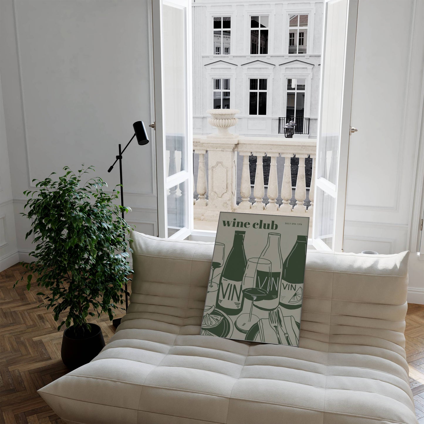 Beige sofa with a decorative pillow featuring illustrated modern wine club art print in a bright room with large windows.